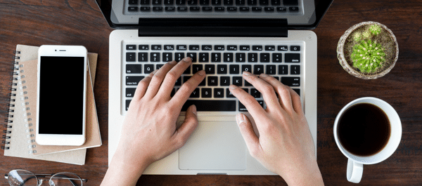 A dyslexic user typing with the latest assistive technology on their computer